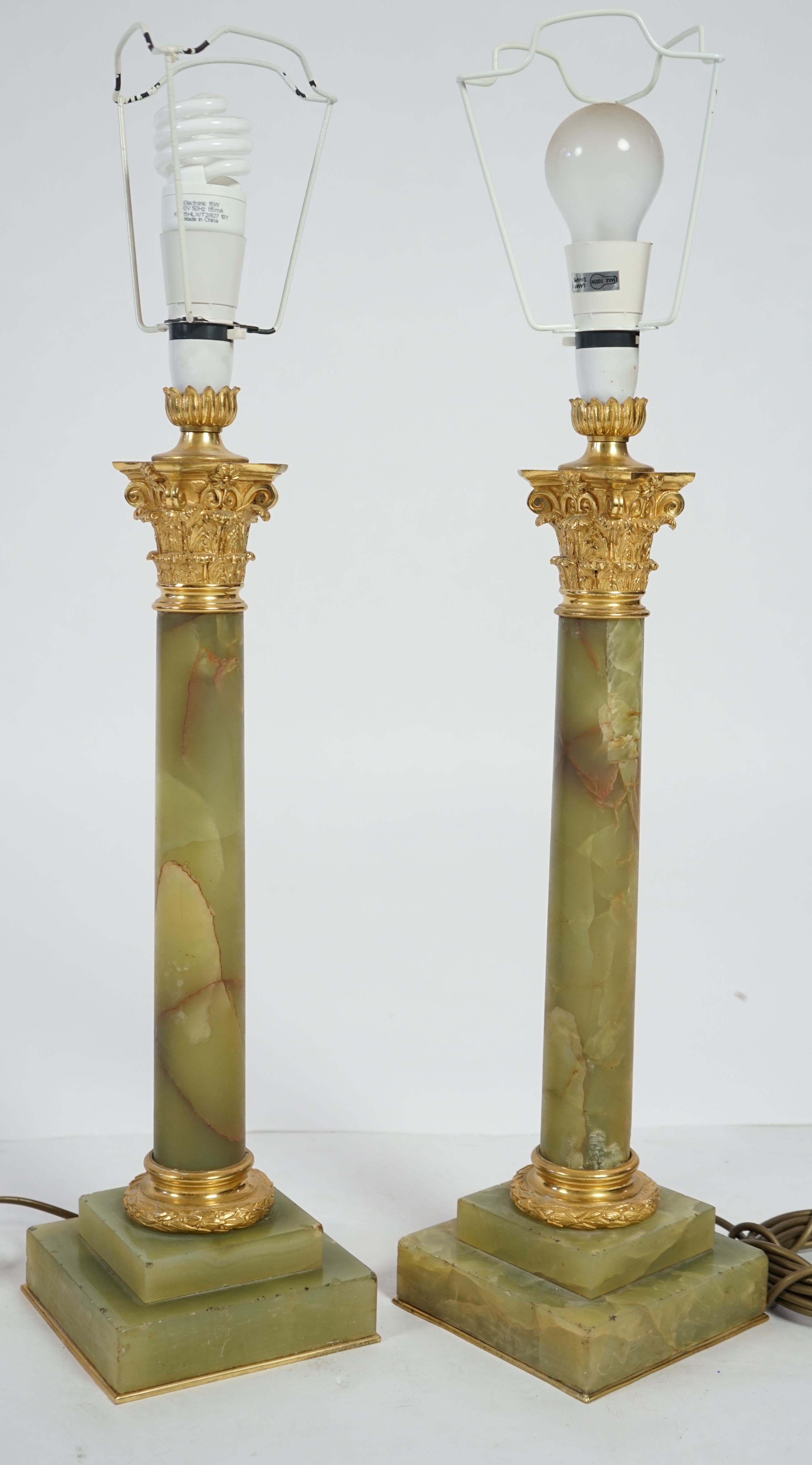 A pair of Victorian ormolu mounted green onyx table lamps